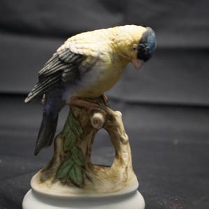 Elegant Yellow Bird Figurine on Tree Branch
