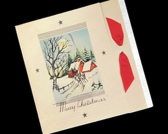 May include: Vintage Christmas card with a winter scene featuring a red-roofed house, horse-drawn carriage, and bare trees. The card has the words "Merry Christmas" and is decorated with stars and red ribbons.