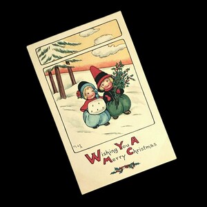 Antica cartolina natalizia Fairman Co. / Serie Pink of Perfection 4920 / Bambini d'inverno / Pupazzo di neve e agrifoglio / 1907-1915