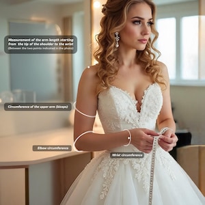May include: A bride in a white wedding dress with a sweetheart neckline, holding a measuring tape. The image shows how to measure arm length, upper arm circumference, elbow circumference, and wrist circumference for dress alterations.