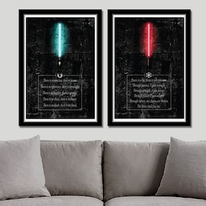 May include: Two black framed prints with a dark background. The left print features a blue lightsaber and a quote about the Force. The right print features a red lightsaber and a quote about peace.