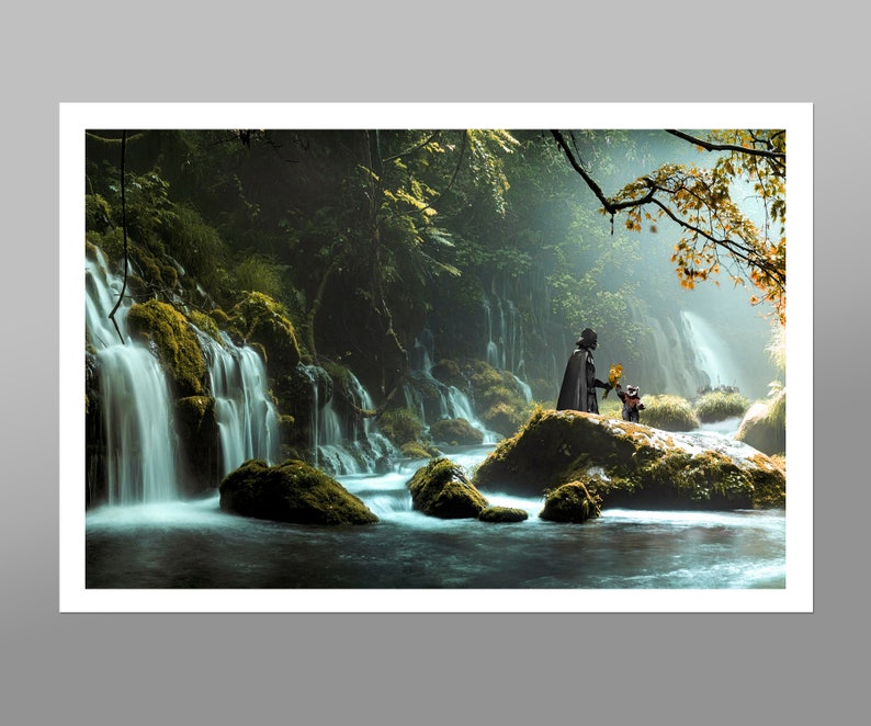 May include: A dark figure stands on a mossy rock in a lush forest setting. A waterfall cascades down the rock face behind them. The figure is holding out a yellow flower to a smaller figure standing beside them.