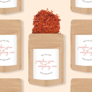 May include: A brown kraft paper pouch filled with red spice flakes. The white label features the text July 11th, 2024, pumpkin spice & everything nice, and Sarah's Baby Shower. The pouch is displayed in a repeating pattern against a light background.