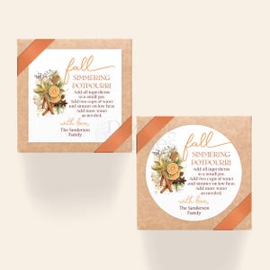 May include: Two square, brown boxes with orange ribbon and white labels. The labels read "fall SIMMERING POTPOURRI" with instructions and a floral design. The text also includes "with love, The Sanderson Family."