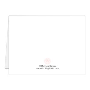 May include: A white folded greeting card with a pink floral design and the text "&copy; Dazzling Daisies www.dazzlingdaisies.com" printed at the bottom. The card is blank on the inside.