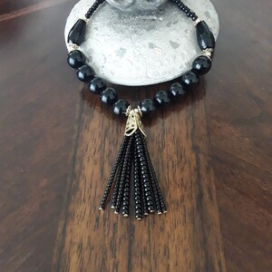 One of a Kind, Medium Black Beaded Tassel Necklace with Gold Accents