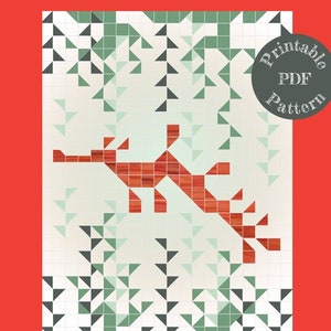 May include: Printable PDF pattern for a 40" x 54" cot quilt featuring a leafy seahorse design. The seahorse is made of red squares and is surrounded by a background of green and gray triangles.