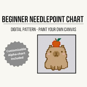 May include: A digital beginner needlepoint chart with a cute capybara design, topped with an orange apple. The chart is in a black frame, with the text "BEGINNER NEEDLEPOINT CHART" and "DIGITAL PATTERN - PAINT YOUR OWN CANVAS". A gray starburst graphic says "Customizable Alpha-chart Included".