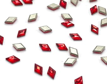 May include: Assortment of red and silver diamond-shaped rhinestones.