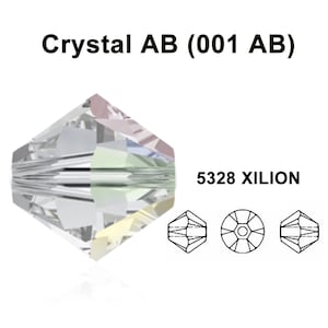 May include: A clear crystal bead with an iridescent finish. The bead is a 5328 Xilion cut, which is a round bead with many facets. The bead is labeled "Crystal AB (001 AB)".