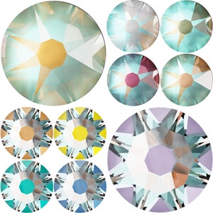 May include: Assortment of 10 round, faceted, iridescent glass rhinestones in various colors, including blue, green, yellow, purple, and white. The rhinestones have a star-shaped design in the center.