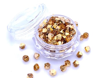 Crystal Aurum 2er (001 AUR2) or véritable Swarovski 5328 XILION perles toupies fabrication de bijoux * Toutes les tailles * Aucun tarif vers les États-Unis * Avec étui de rangement