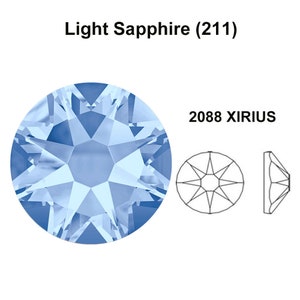 May include: A light blue round crystal rhinestone with a star-shaped design. The crystal is labeled "2088 XIRIUS" and "Light Sapphire (211)".