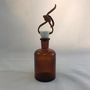 T. C. W. Co. Apothecary Brown Glass Bottle with Ceramic Stopper, Small Bottle, Ceramic Stopper with Leather Thong, Collectible Bottle,