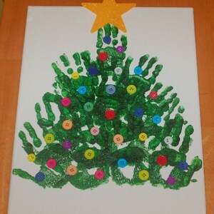 May include: A green handprint Christmas tree with colorful buttons as ornaments and a gold glitter star on top.