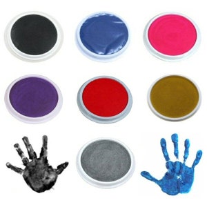 May include: Set of ten round ink pads in various colors, including black, blue, red, purple, brown, and gray. The ink pads are in a white plastic casing with a round ink pad inside. The ink pads are arranged in three rows of three, with one ink pad in the bottom row.