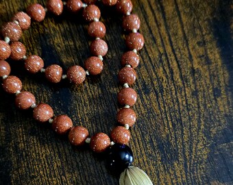 Goldstone Strength Mala with Black Onyx Guru