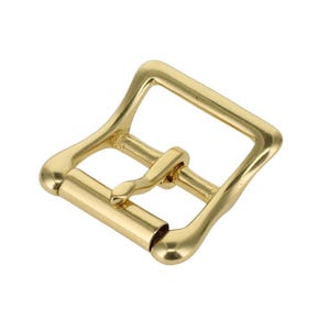 May include: A gold-toned metal belt buckle featuring a square frame with rounded corners and a central prong. The buckle has a smooth, polished finish and a sturdy construction, designed for securing a strap through the center bar mechanism.
