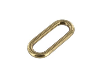 May include: A gold-toned oval metal ring with a smooth finish. The ring has a large opening in the center.