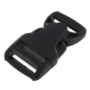 May include: Black plastic side release buckle for webbing or straps. The buckle has a smooth, matte finish.