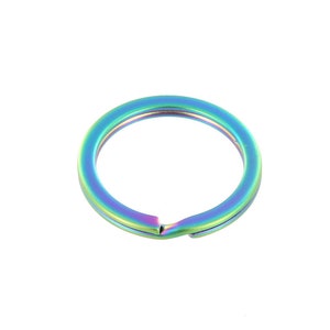 May include: A rainbow-colored metal key ring. The ring is made of a durable metal and has a smooth, polished finish.