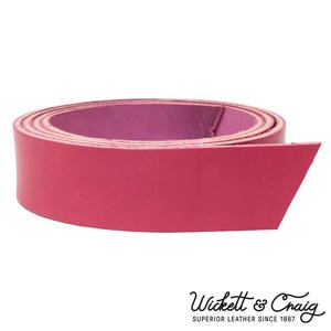 May include: A roll of vibrant pink leather strip, likely for crafting or leatherwork. The leather is a solid color with a smooth texture. The brand name "Wickett & Craig" is visible at the bottom.