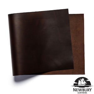 May include: Two sheets of dark brown leather are displayed against a white background. The top sheet is folded over, revealing a lighter brown, textured underside. The Newbury Leathers logo is in the bottom right corner.