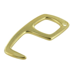May include: A gold-colored metal touch tool with a hook and a square loop. The tool is designed to help people open doors and press buttons without touching surfaces with their hands.
