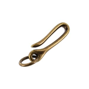 May include: A brass key chain hook with a ring. The hook is curved and has a smooth finish.