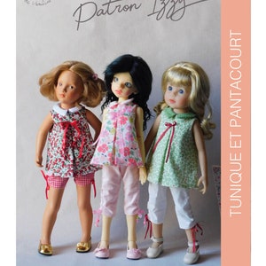 May include: Three dolls wearing different patterned dresses and shorts. The dolls are standing side-by-side and are all smiling. The text "Tunique et Pantacourt" is written vertically on the right side of the image. The text "Patron Izzy" is written in cursive at the top of the image.