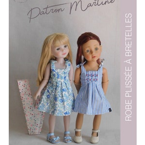 May include: A sewing pattern for a pleated dress with straps for dolls. The pattern is called "Patron Martine Robe Plissée à Bretelles".