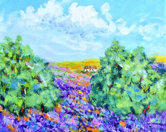 May include: An oil painting on canvas depicting a vibrant landscape with a field of purple lavender and orange flowers in the foreground. Two large green trees frame the scene, leading to a small white house under a bright blue sky with white clouds.