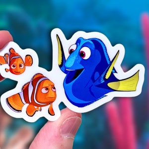 Nemo, Dory + Marlin Sticker | “Just Keep Swimming” Finding Nemo Disney Pixar Vinyl Decal for Car, Laptop, Water Bottle, Planner | 3&quot; x 1.84&quot;