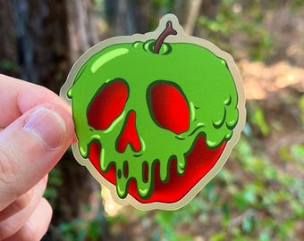 May include: A green apple with a red skull face and dripping green slime. The apple is a sticker.