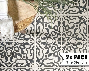 May include: Two black and white tile stencils with a geometric pattern. The stencils are on a white background and the text "2x PACK Tile Stencils" is in the lower right corner.