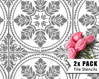 May include: Two gray tile stencils with a floral design. The stencils are on a white background and there are pink roses in the bottom right corner. The text "2X PACK Tile Stencils" is in the bottom right corner.
