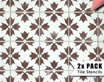 May include: Two brown tile stencils with a floral design. The stencils are on a white background and the text "2X PACK Tile Stencils" is in the bottom right corner.