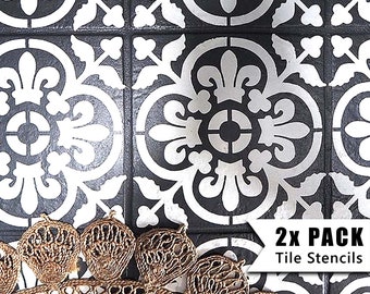 May include: Two black and white tile stencils with a floral design. The stencils are made of durable plastic and are reusable. The stencils are shown on a floor with a rug.