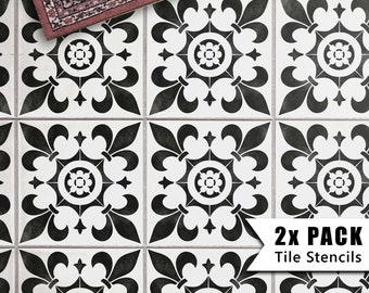 May include: Two black and white tile stencils with a fleur-de-lis design. The stencils are on a white background and are labeled "2x PACK Tile Stencils".