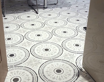 May include: A white floor with a repeating pattern of gray and white circles. The circles have a decorative design with a central dot.