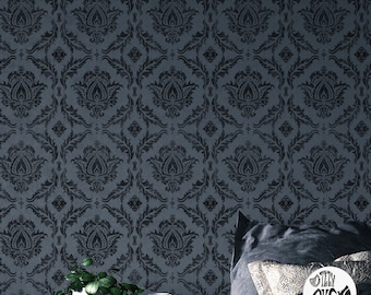 May include: A dark blue damask patterned wallpaper with a black floral design. The wallpaper is shown in a room with a bed and a side table with a plant and a cup.