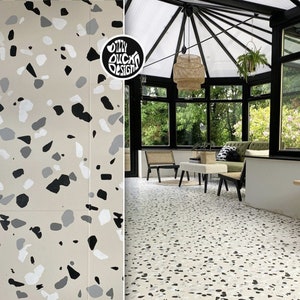 May include: A black and white terrazzo floor pattern with a beige background. The pattern is shown in a close-up view and also in a larger view of a sunroom with black framed windows and a wicker pendant light.