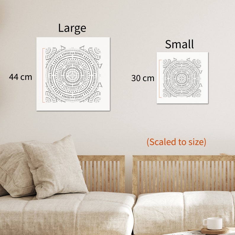 May include: Two square wall art prints featuring a geometric mandala design in black and white. The larger print measures 44 cm and the smaller print measures 30 cm.