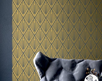 May include: Gold and blue geometric wallpaper with an art deco pattern. The wallpaper is shown on a wall behind a gray couch with a pillow.