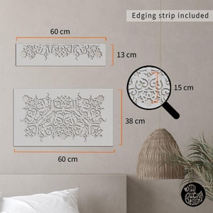 May include: A white stencil with a decorative pattern. The stencil is 60 inches wide and 38 inches tall. The stencil is shown on a wall with a light brown background. The text "Edging strip included" is visible in the upper right corner of the image.