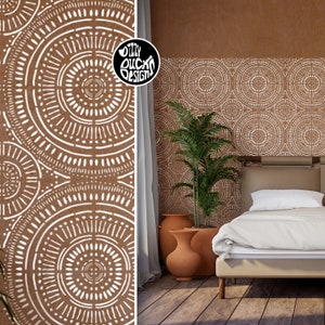 May include: A brown wall with a white geometric pattern of circles and lines. The pattern is repeated across the wall. A potted plant is in front of the wall. A bed with white linens is in front of the plant. The text "OZZY DUCKS DESIGNS" is in the upper left corner of the image.