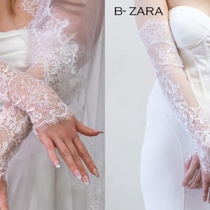 May include: Two pairs of white lace fingerless gloves. Option A-IRIS features a dense floral lace pattern with scalloped edges. Option B-ZARA displays a sheer mesh base with intricate floral lace detailing extending from the wrist to the forearm.