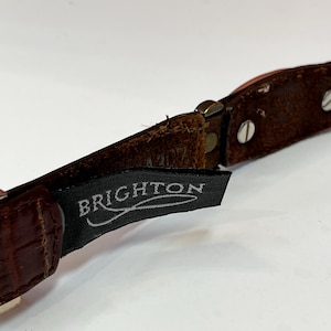 May include: A set of three ceramic mugs with a speckled, matte finish. The mugs are in shades of cream, light gray, and dark gray. Each mug has a simple, minimalist design, perfect for coffee or tea.