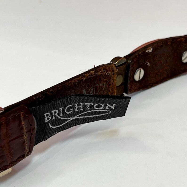 May include: A set of three ceramic mugs with a speckled, matte finish. The mugs are in shades of cream, light gray, and dark gray. Each mug has a simple, minimalist design, perfect for coffee or tea.