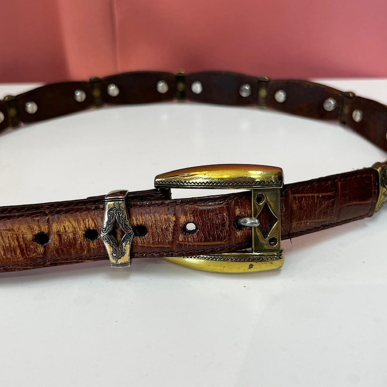 May include: A set of three ceramic mugs with a speckled, matte finish. The mugs are in shades of cream, light gray, and dark gray. Each mug has a simple, minimalist design, perfect for coffee or tea.